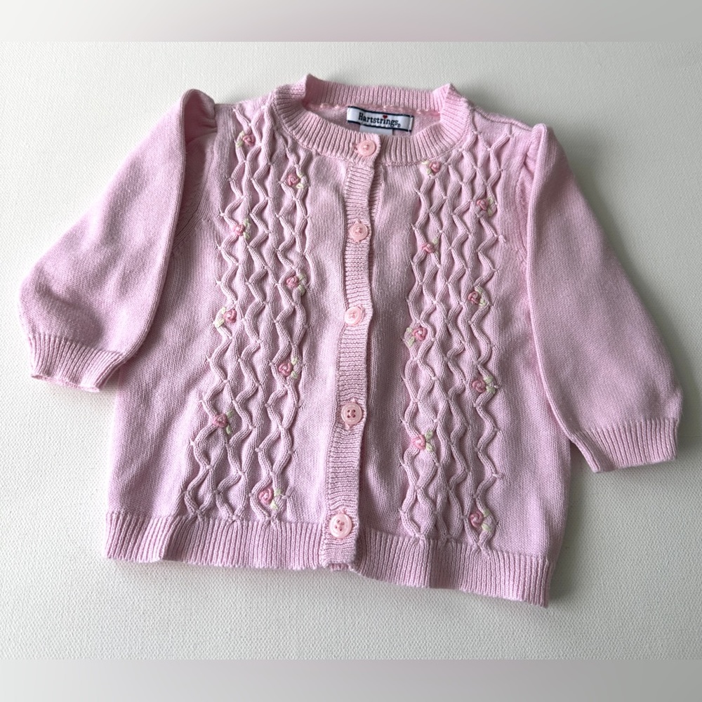 Hartstrings Baby Girl’s pink and features knitted patterns.  Size 3-6M